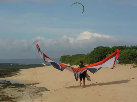 Incredible high mountains rise above this pretty beach.