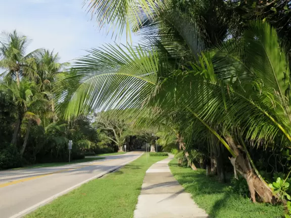 Beach with technicolor blue-green water sometimes, and a huge shady picnic pavilion where neighbors gather to watch the water, on beautiful Jupiter Island.