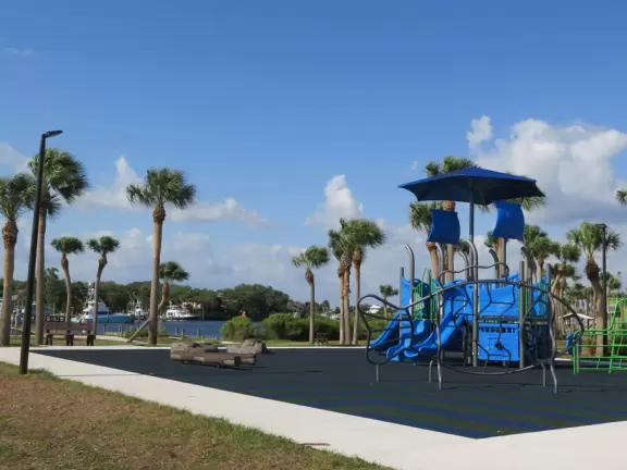 Waterfront park with amazing colors in the water- views of an island and blue-green sandbars. Plenty of benches and docks, and a playground.