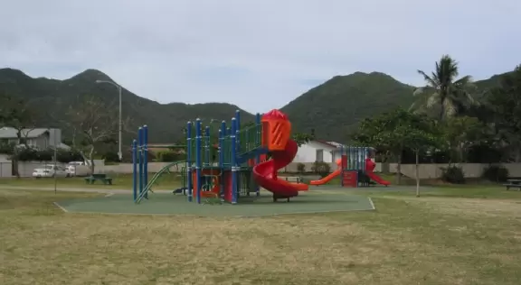 A simple playground surrounded by nice mountains.
