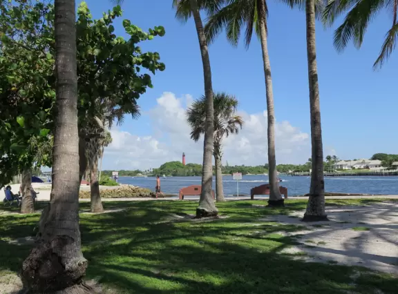 Large lagoon with clear water where kids can swim, tons of shade, and playground in the sand.