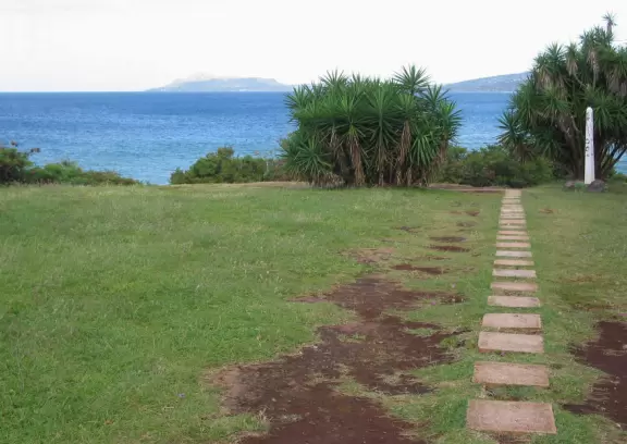 Sit on the rock ledge and watch the water swirl and spray below you!
