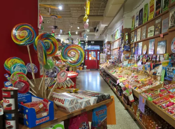 Gorgeous main street with large, European-style park where people sit on the grass by the fountain.