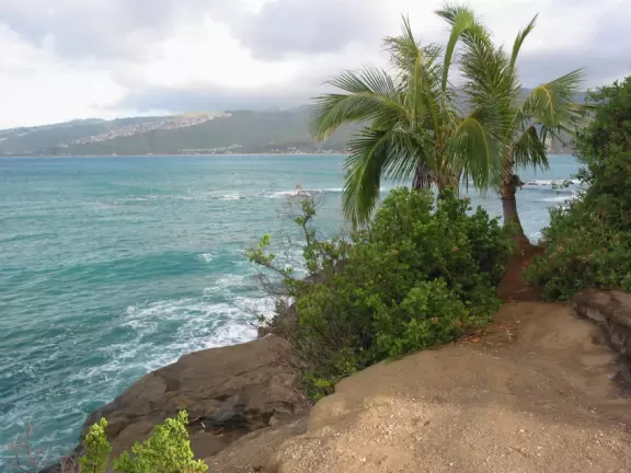 Sit on the rock ledge and watch the water swirl and spray below you!