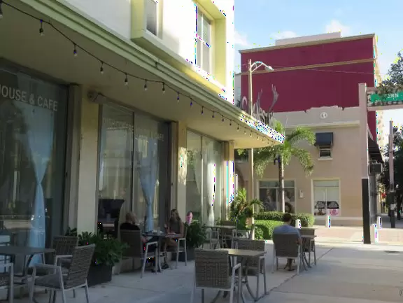 Main strip of West Palm Beach, with colorful and inviting architecture and decorations.
