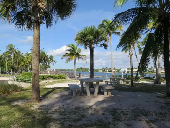 Large lagoon with clear water where kids can swim, tons of shade, and playground in the sand.