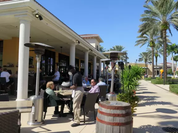 Outdoor mall with movie theater, cafes with atmosphere, candy shop, and more.