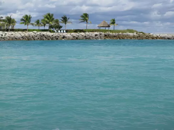 Beach where fishermen hang out on the jetty and surfers come to ride the waves at Jupiter Inlet.