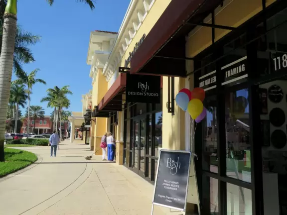 Outdoor mall with movie theater, cafes with atmosphere, candy shop, and more.