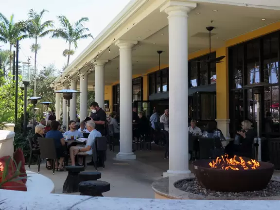 Outdoor mall with movie theater, cafes with atmosphere, candy shop, and more.