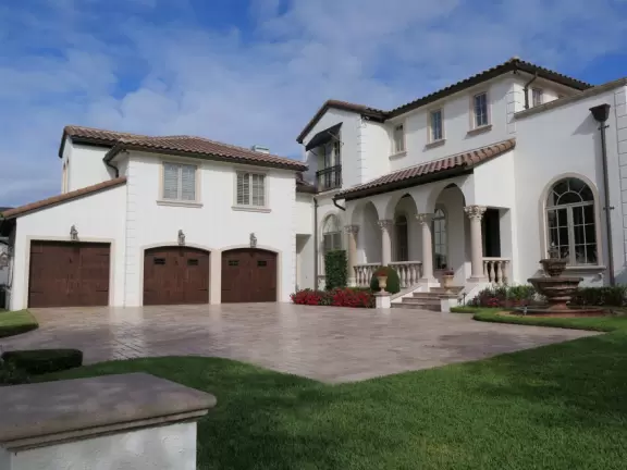 Walk past lake with cypress trees, and down three culdesacs with mansions.