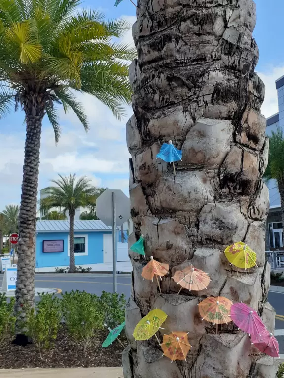 Ultra colorful resort with palm trees galore, live music by the pool, hotel rooms plus cottages, and shopping center.