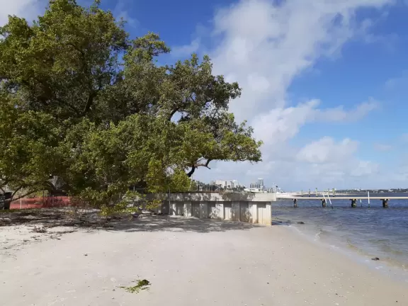 Small neighborhood park in a historical district on the intracoastal waterway with toddler playground and swings.