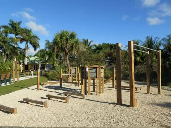 One kilometer loop trail with two exercise stations, crushed shell trail under tall trees, yellow sand dune, then a loose white sand trail up a hill!