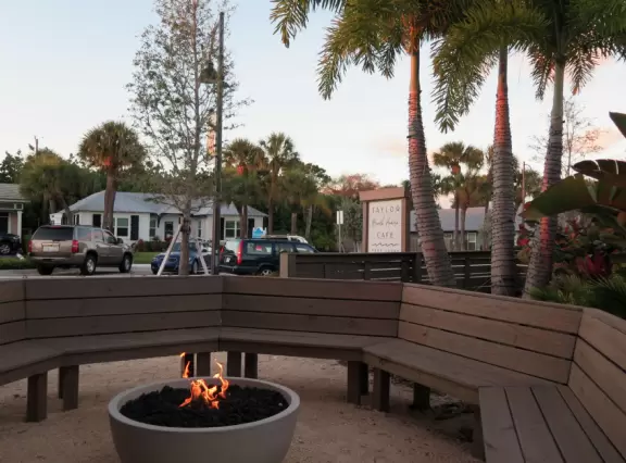 Small beach town with coffee shops, cafes with live music, magical banyan tree walk, hilly walks, beach with sea oats and vibrant turquoise water, and white-sand intracoastal beach.