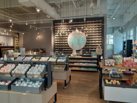 High-end outdoor shopping area with nice cafes and shops.