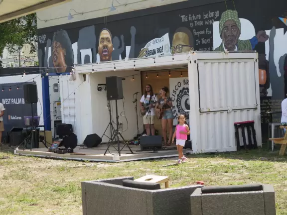 Main strip of West Palm Beach, with colorful and inviting architecture and decorations.