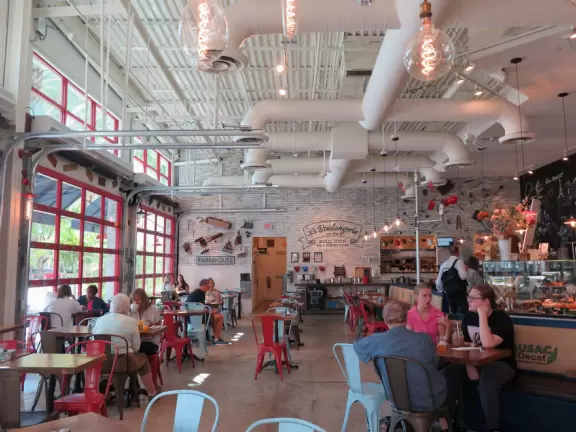 Indoor mall with sun canopies, decorative towers, fountains, and atriums.
