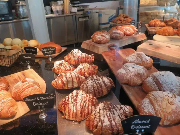 Indoor mall with sun canopies, decorative towers, fountains, and atriums.