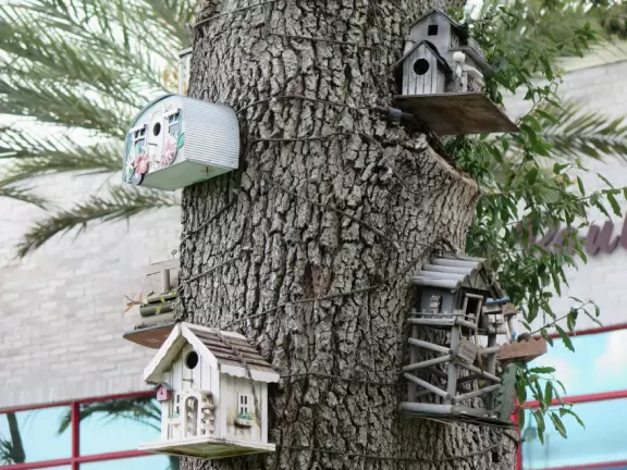 Indoor mall with sun canopies, decorative towers, fountains, and atriums.