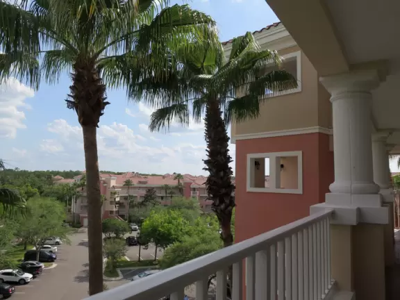 Gorgeous pool areas with splash pad and water cannons, lit up beautifully at night.