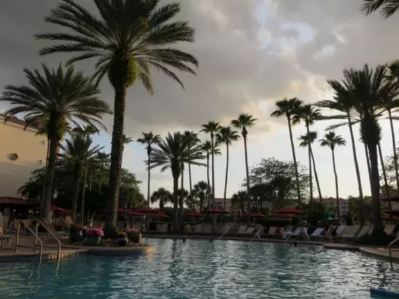 Gorgeous pool areas with splash pad and water cannons, lit up beautifully at night.