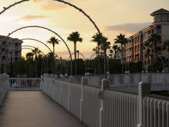 Gorgeous pool areas with splash pad and water cannons, lit up beautifully at night.