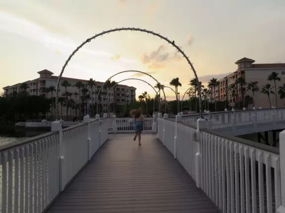 Gorgeous pool areas with splash pad and water cannons, lit up beautifully at night.