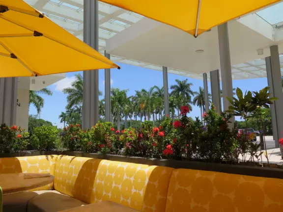 Indoor mall with sun canopies, decorative towers, fountains, and atriums.