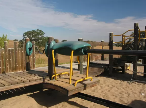 Pretty area with manmade lake and nice wooden playground.