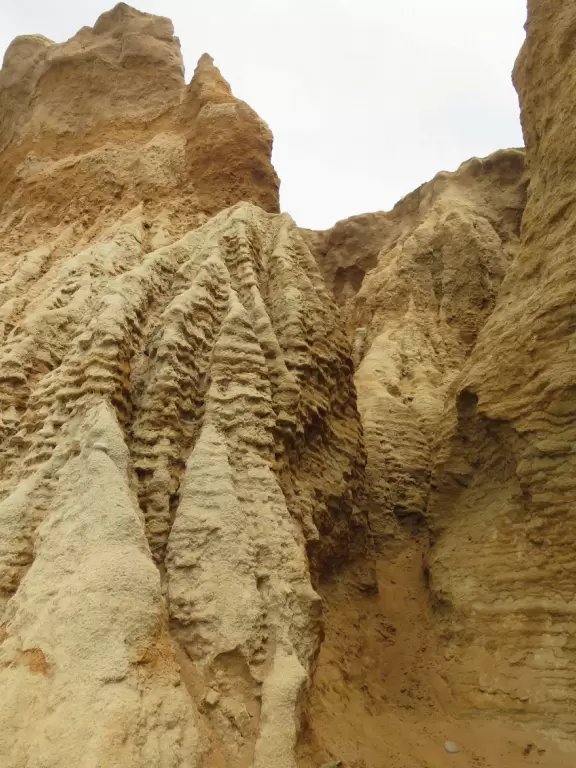 Gorgeous beach with steep steps leading down, and red cliffs like a national park!