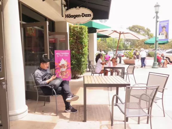 A colorful, spacious outdoor mall with boba tea, a toy store, and lots of teen clothing stores!