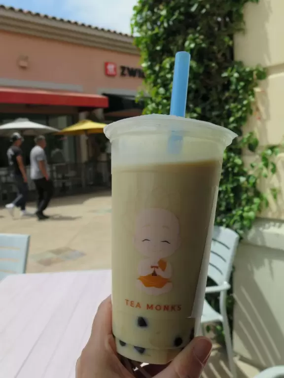 A colorful, spacious outdoor mall with boba tea, a toy store, and lots of teen clothing stores!