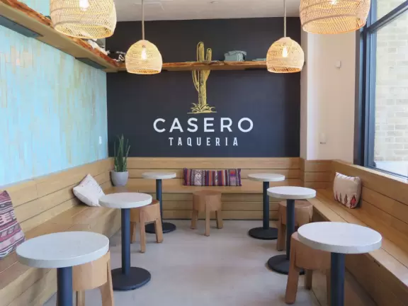 Modern shopping plaza with cafe balconies up high with a view.