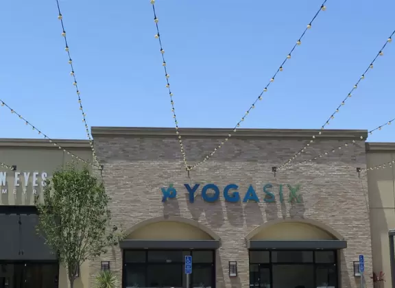 Modern shopping plaza with cafe balconies up high with a view.