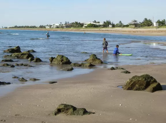 Ultra-shallow clear waters protected by a reef make this a perfect swimming spot for very young children.