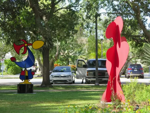 Popular park with big trees, a pond with ducks, and a fun playground!