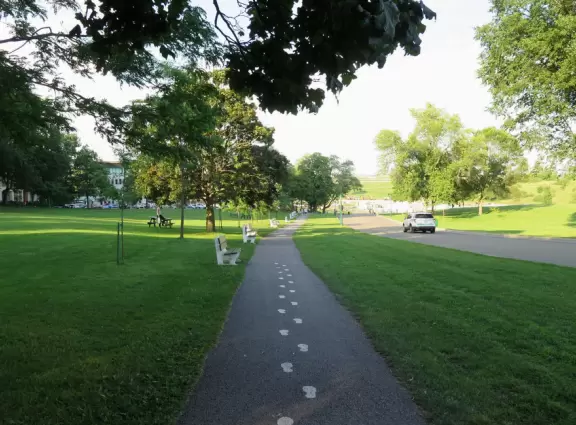 Sweet little spot to sit, with flower beds and benches.