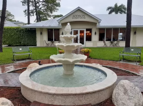 The fountain helps you find the coffee shoppe. 