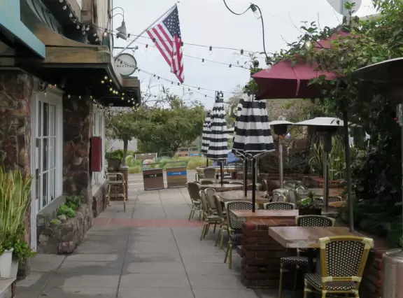 Cute street to walk along, with cafes and shops, a few blocks back from the beach.