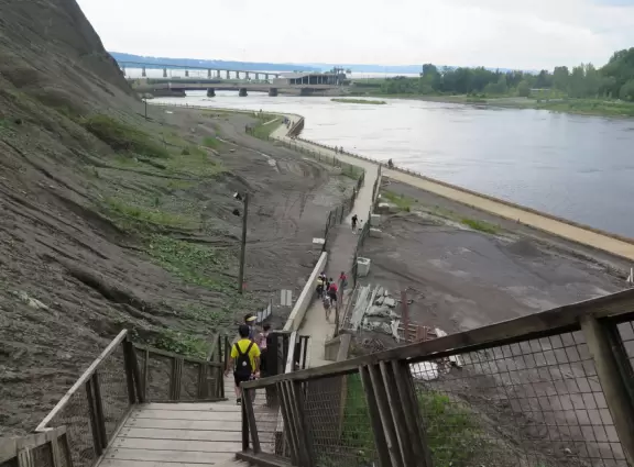 Tall waterfall at the mouth of the Montmorency River. You can walk stairs up to a suspension bridge over the falls.