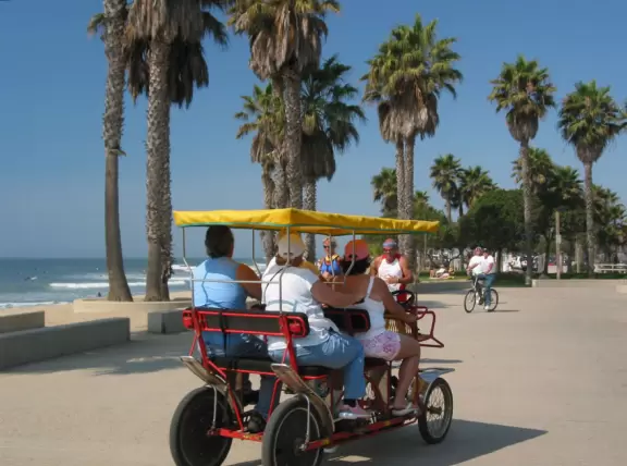 An amazing place to watch surfers ride the waves close up and in the shade, at that!