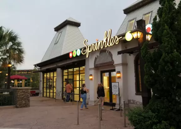 Waterfront area with restaurants, live street performers, entertainment, toy stores, and carousel.