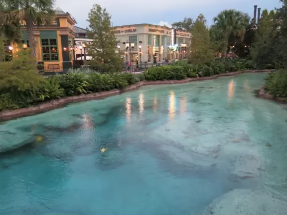 Waterfront area with restaurants, live street performers, entertainment, toy stores, and carousel.