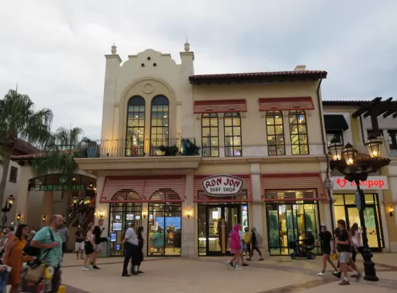 Waterfront area with restaurants, live street performers, entertainment, toy stores, and carousel.