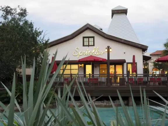 Waterfront area with restaurants, live street performers, entertainment, toy stores, and carousel.