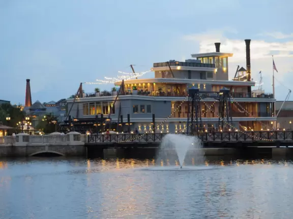 Waterfront area with restaurants, live street performers, entertainment, toy stores, and carousel.