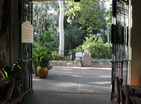 A main street of late 19th century storefronts, popular cafes, and a hip college scene. Recently, suffering an epidemic of homelessness relating to mental health problems.