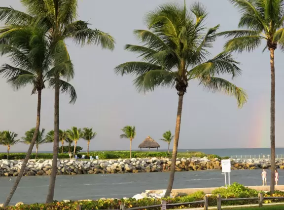 Beach where fishermen hang out on the jetty and surfers come to ride the waves at Jupiter Inlet.