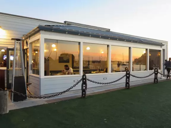 A delightful rock, beautiful wildlife, peaceful idyllic estuary, imaginative playground, and colorful little town.